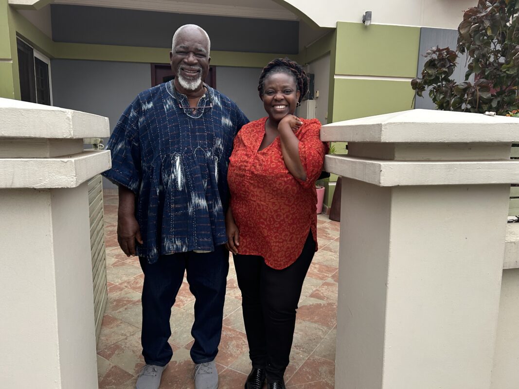 Yena and K.K., owners of Yena's Nest Bed & Breakfast in Accra standing at the gate.